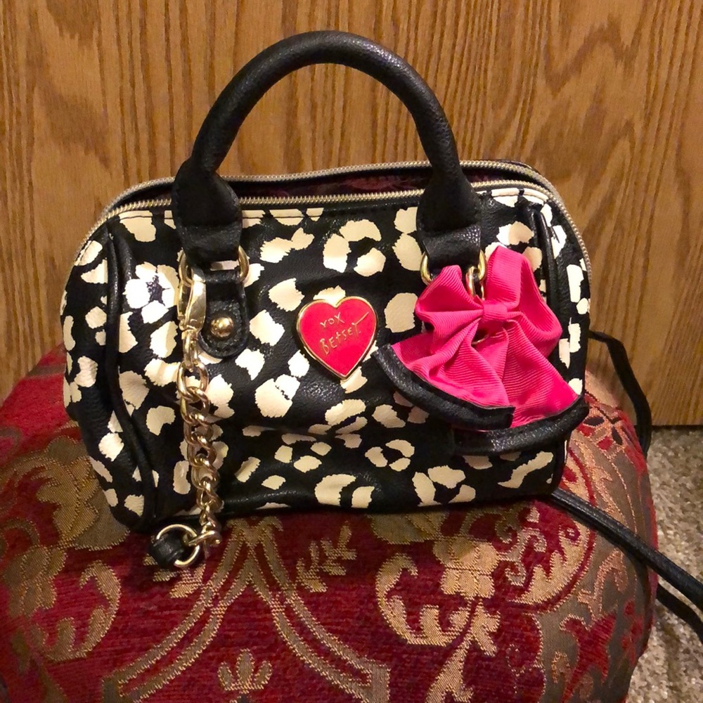 Black and white cow print purse